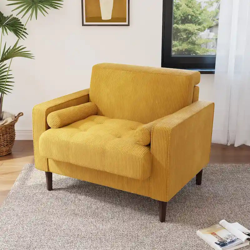 Poltrona moderna d'accento imbottita in velluto a coste con braccioli e cuscini